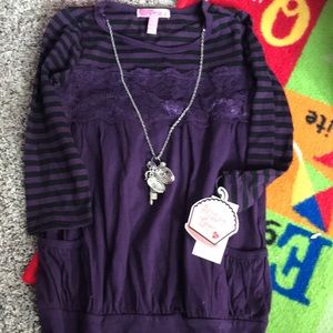 Girl top with jewelry. Hole on back of right arm